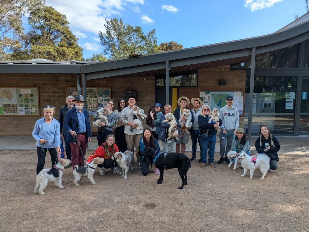 Pawshare Club members and their dogs gathered outside a community venue